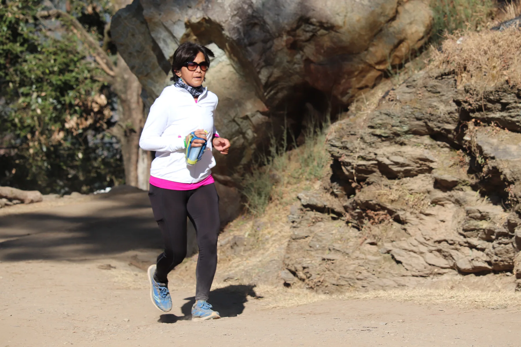 Nainital Trail Ultra archive: Runner carrying a water bottle on the trail